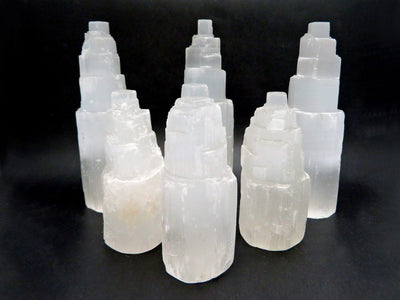 6 assorted selenite towers with a black background