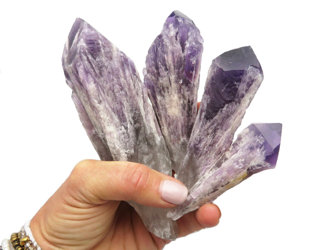 Elestial Amethyst Point - Natural - By Weight on a hand