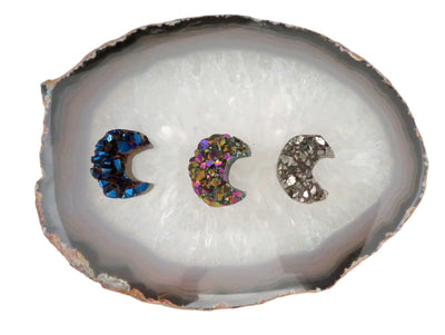 3 Titanium Druzy Stone Moons on display to show the diffrent colors in stock Blue , Rainbow and Platinum. 