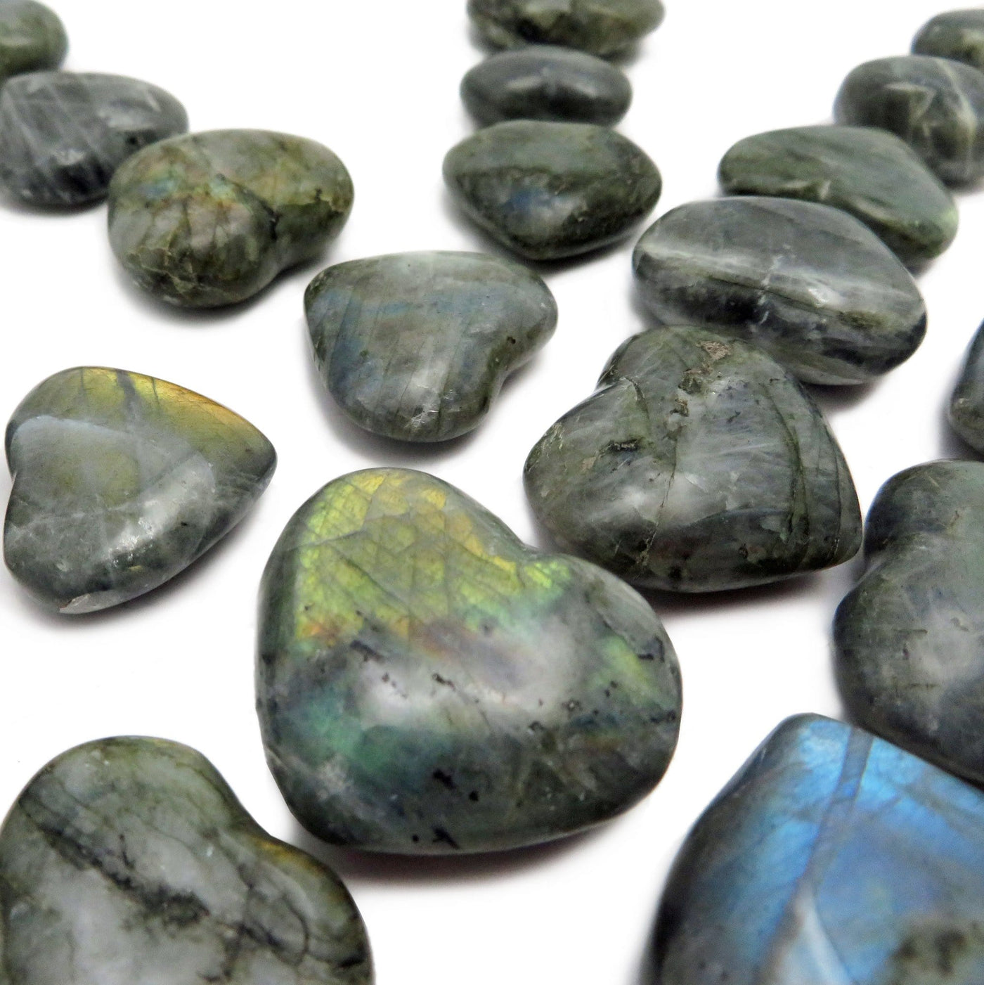 Labradorite Hearts on a white background showing its beautiful glowing colors