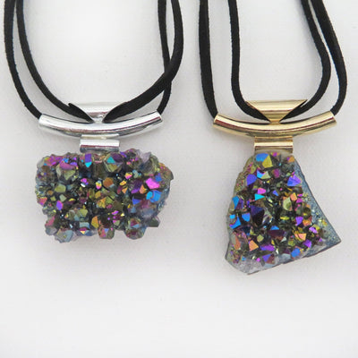 necklaces available in silver or gold with a rainbow titanium finish 
