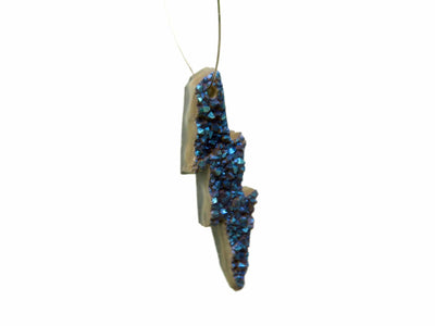 Druzy Lightening Bolt Bead hanging on a wire