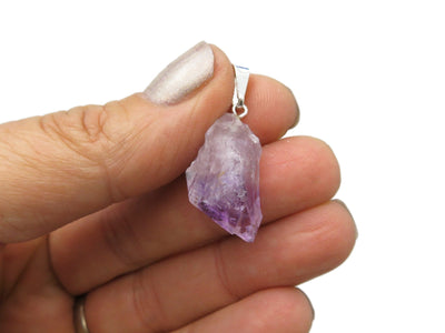 Petite Amethyst Quartz Point Pendant with silver bail  in hand for size comparison