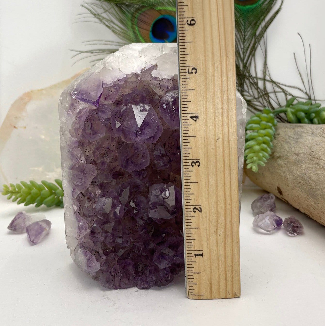 Amethyst Crystal Cluster Polished Point next to a ruler for size reference