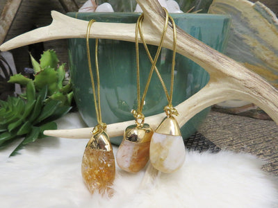 Citrine Polished Crystal Ornament in gold electroplated cap with gold tone string