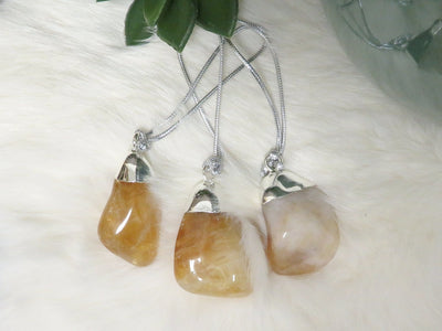 Silver Citrine Polished Crystal Ornament displayed to show various color hues sizes and natural inclusions