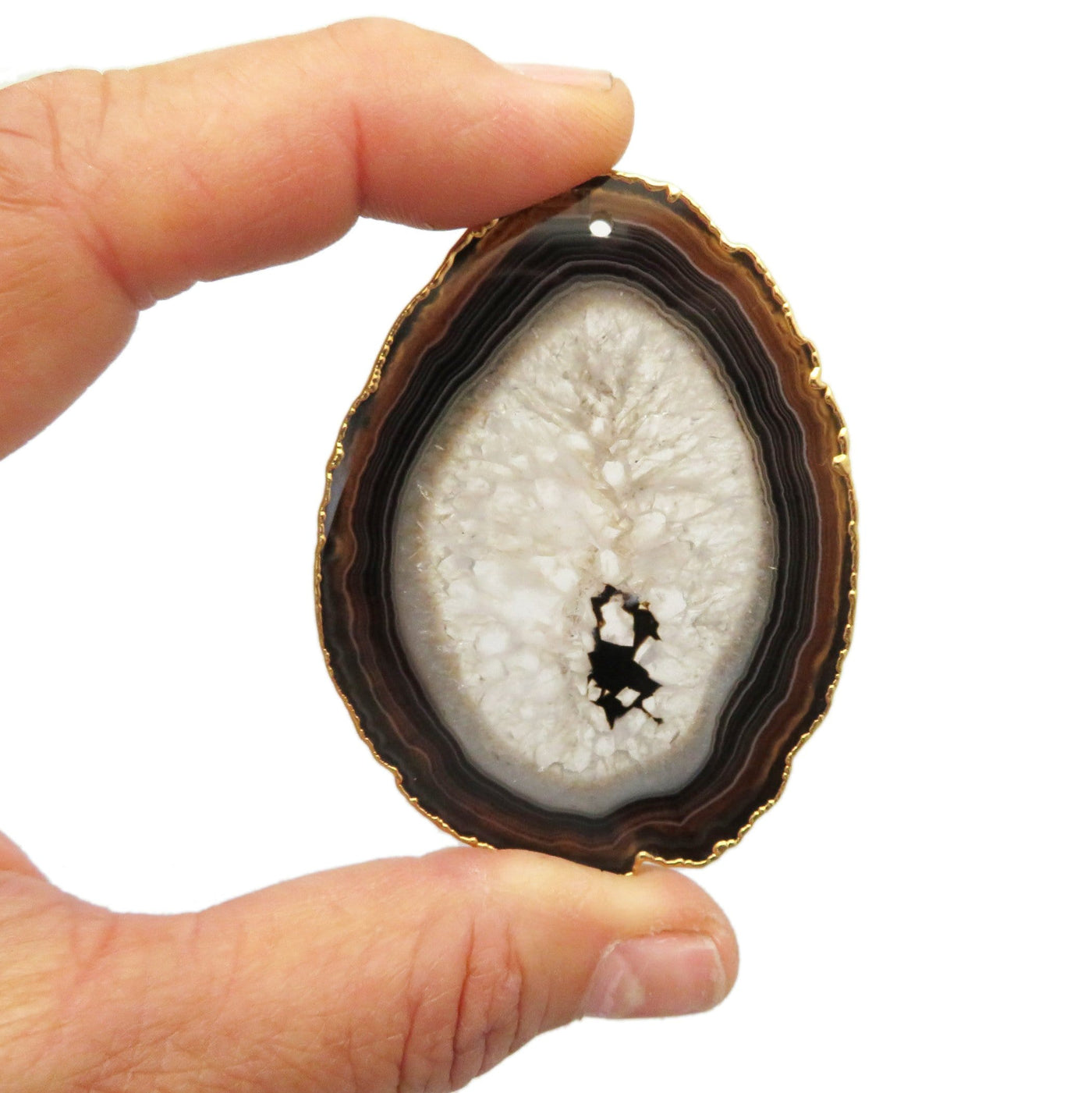This picture is showing one of our black/gold agate slices being held in hand for size reference.