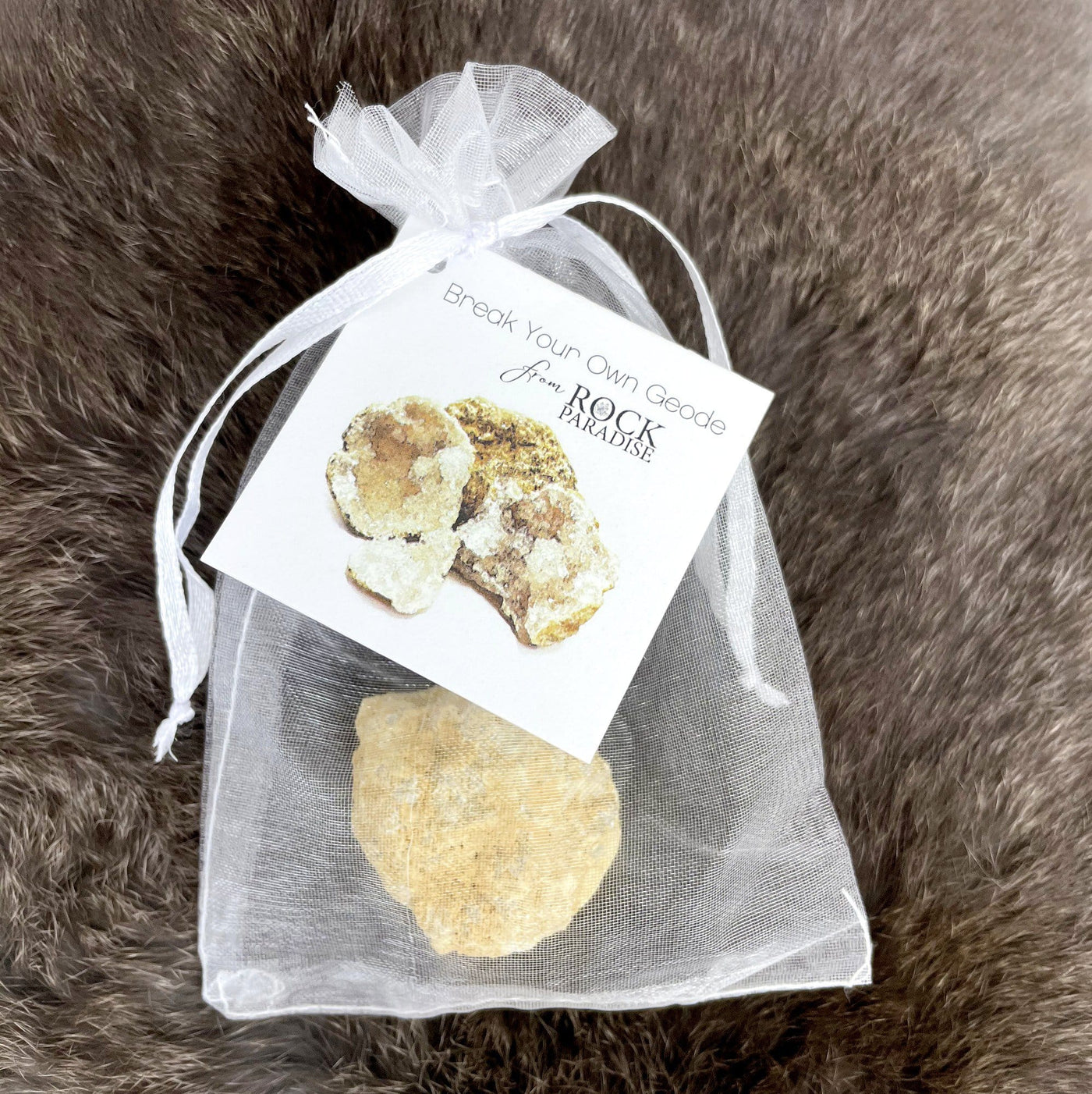geode in a mesh bag with a tag