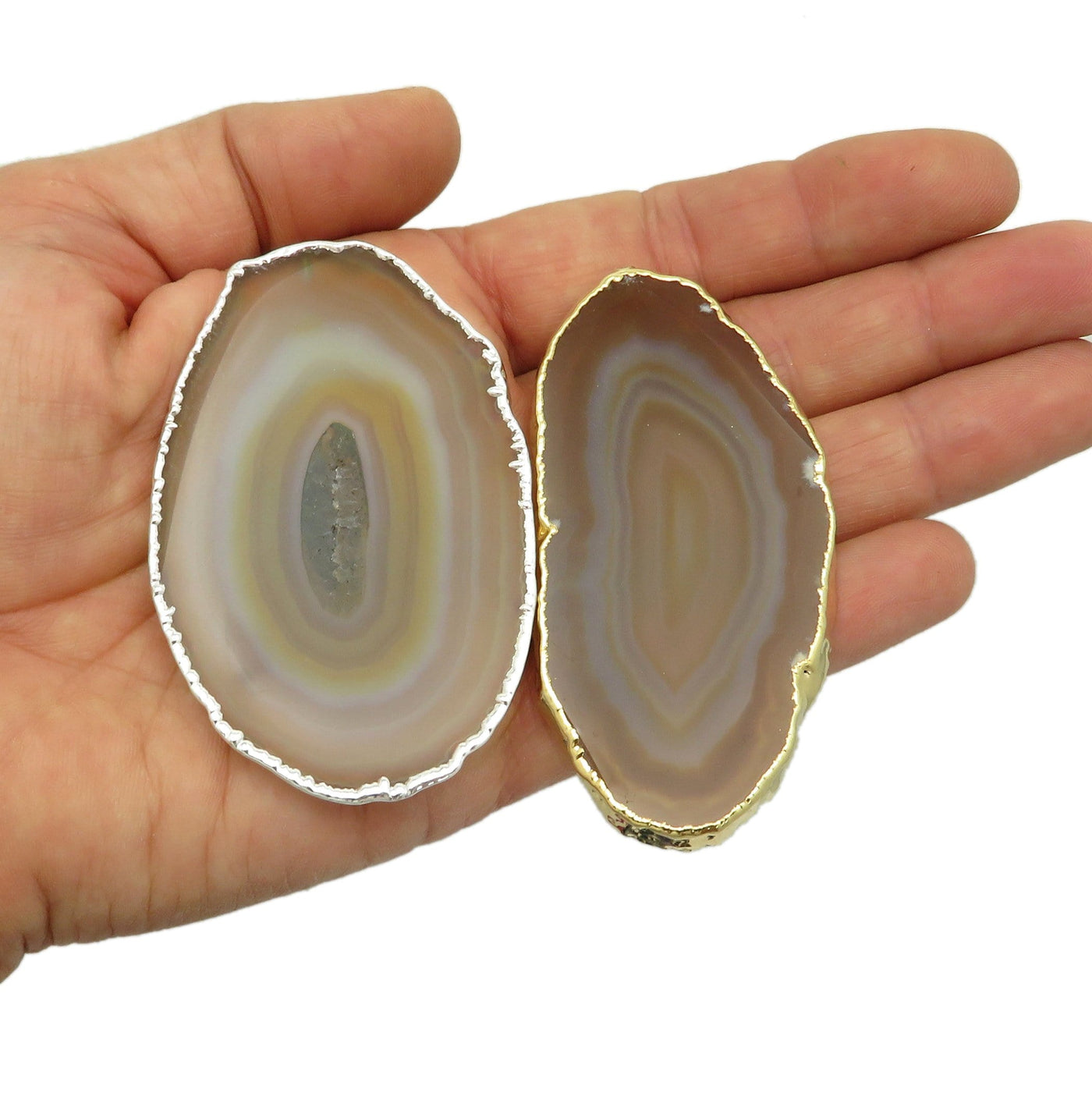 This picture is showing two of our natural agate plated edge, silver and gold tone in hand for size reference.