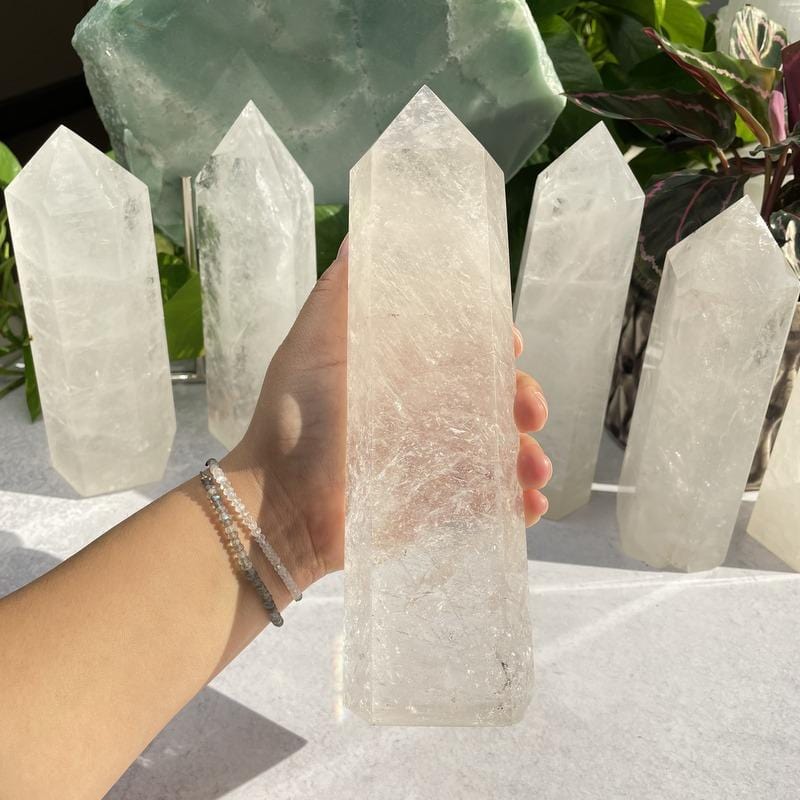 crystal quartz tower in hand for size reference