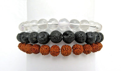 different healing stone bracelets on a white display stand