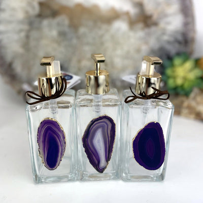 Picture of three of our purple agate soap dispensers.