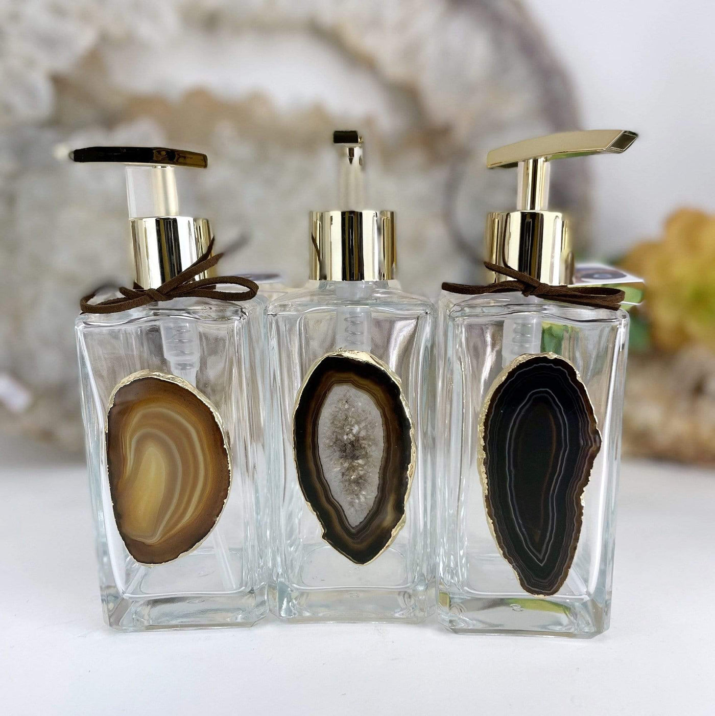 Picture of three of our black agate soap dispensers.
