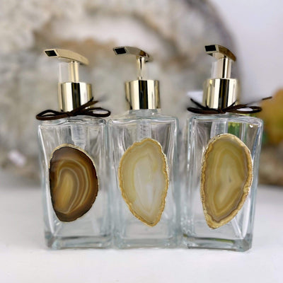 Picture of three of our natural agate soap dispensers.