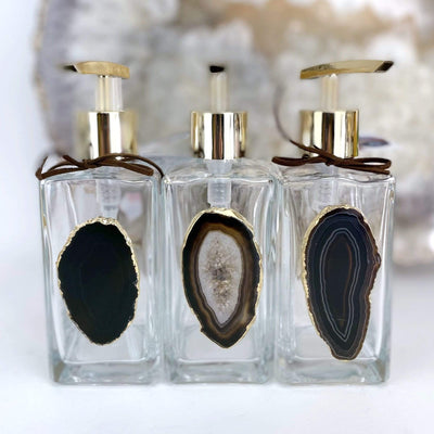 Picture of three of our black agate soap dispensers.