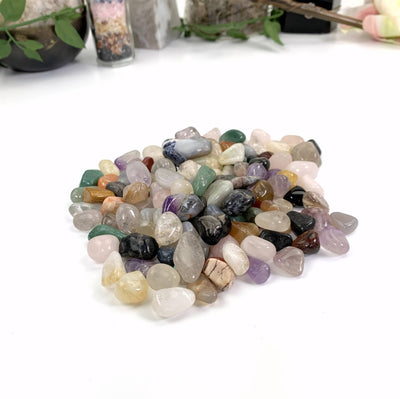 Mixed Natural Tumbled Gemstones on a white background