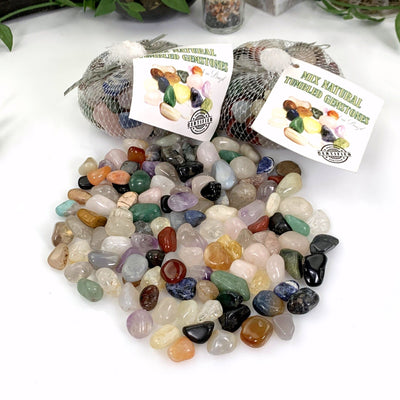 Mixed Natural Tumbled Gemstones on a white background