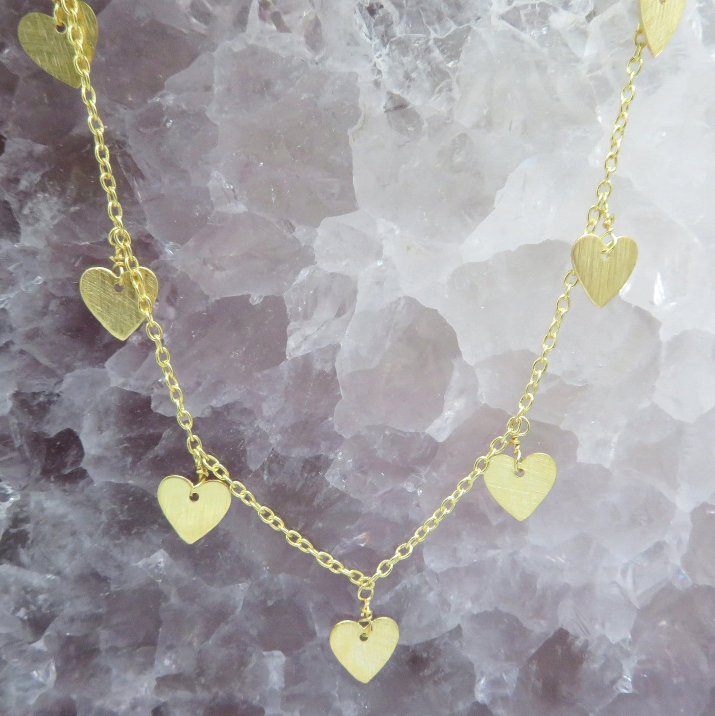 Gold Heart Dangle Chain Necklace, Closeup of hearts