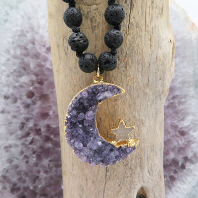 amethyst druzy moon with tiny star in the center of crescent shows natural crystal formation