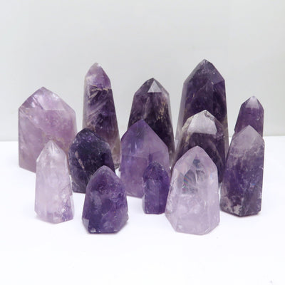 Amethyst towers displayed with white background varying in size 