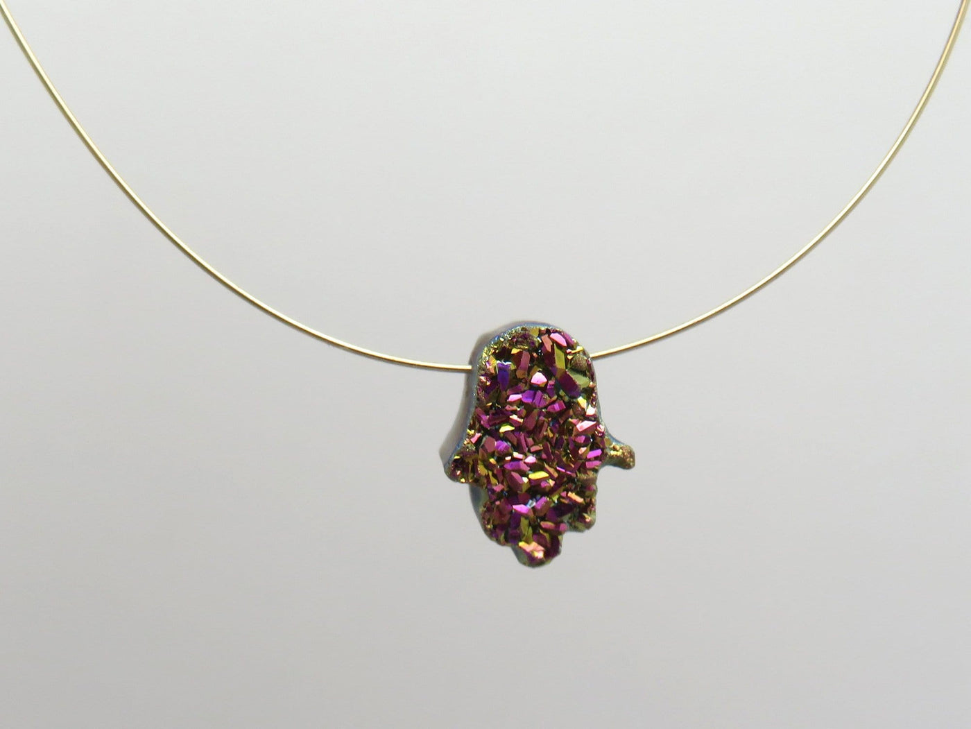 head drilled hamsa bead titanium druzy pictured with wire to show as a necklace 