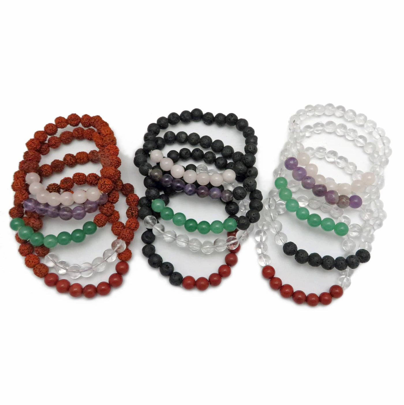 varied healing stone bracelets placed next to each other on a white background