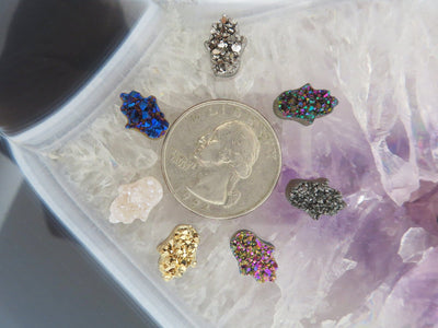 head drilled hamsa bead titanium druzy in assorted colors shown around a quarter for size reference