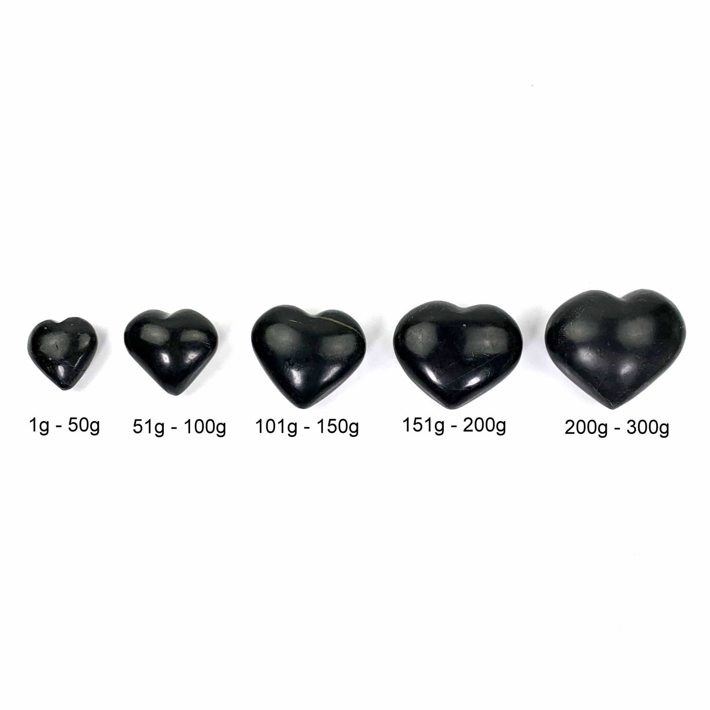 the 5 different size variations of black onyx hearts lined up to show size difference