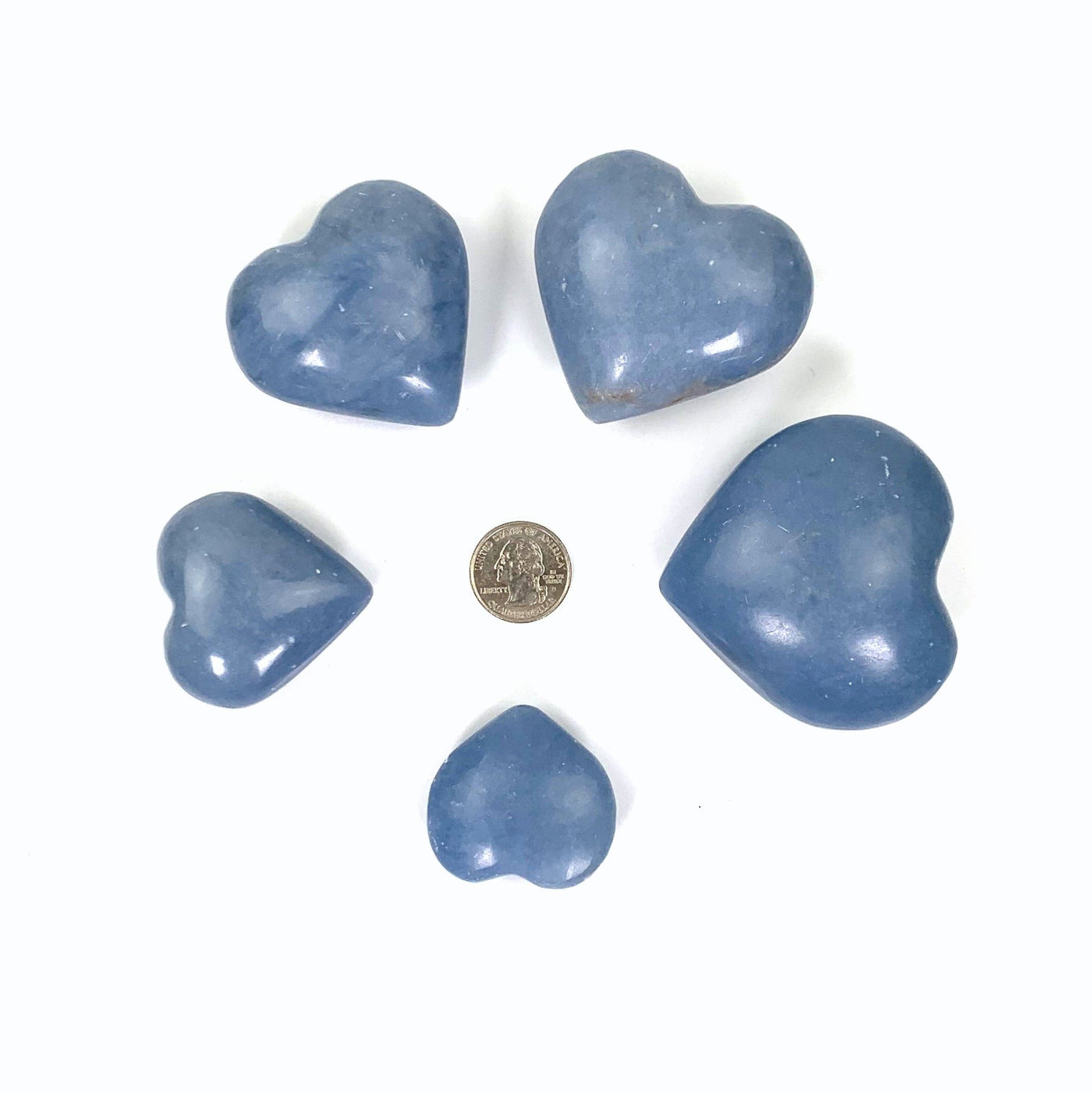 the 5 angelite size hearts surrounding a quarter for sizing reference