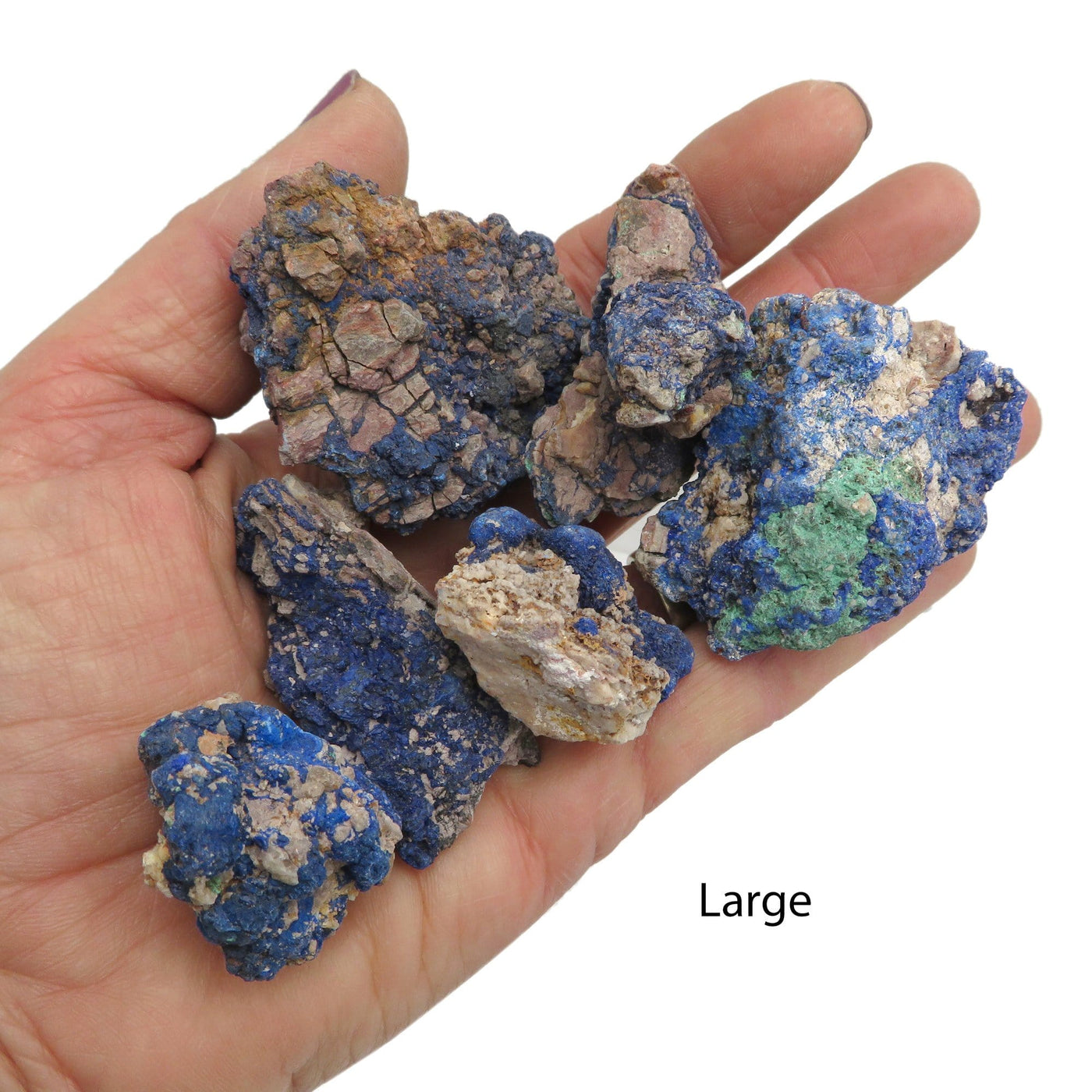large azurite stone pieces in hand for size reference 