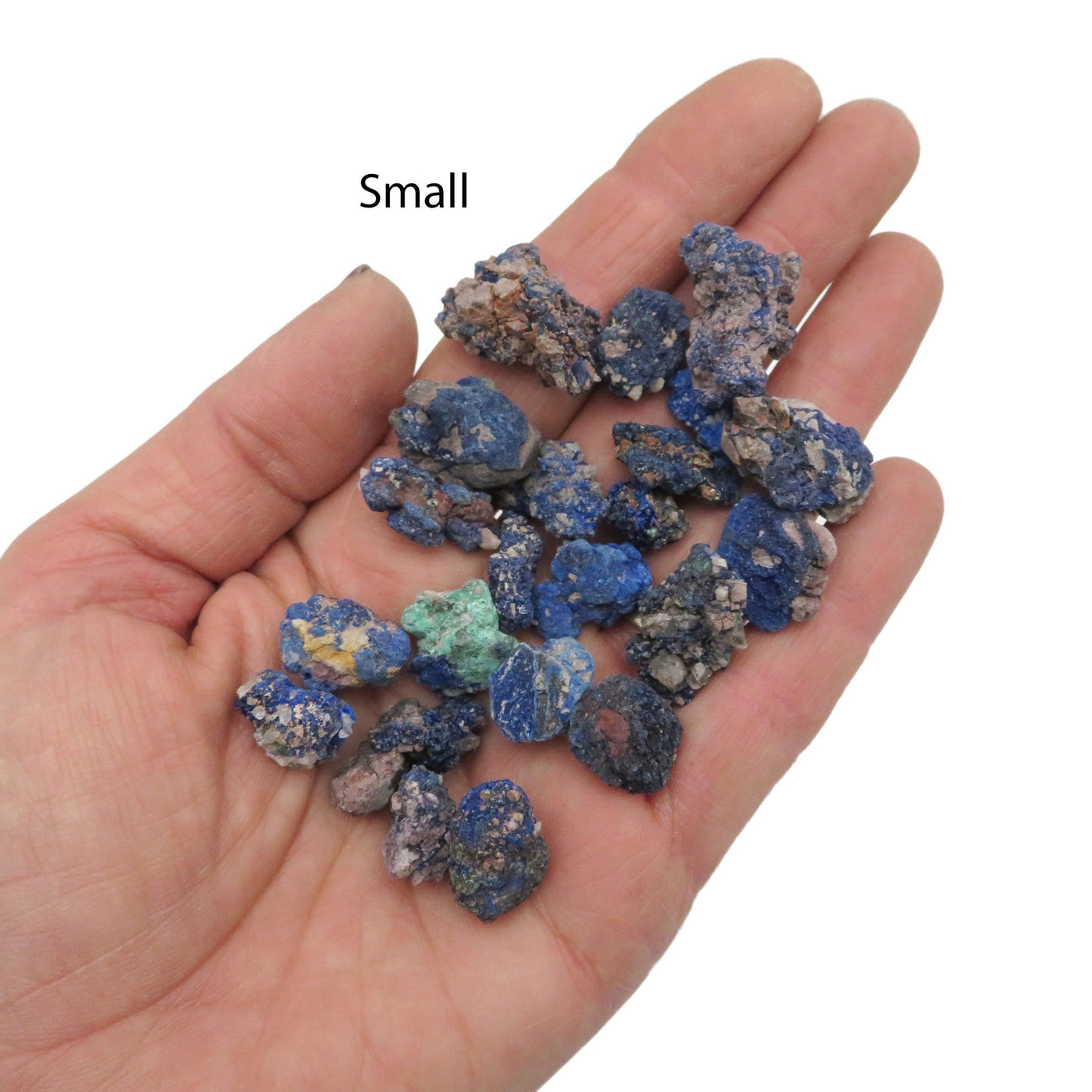 small azurite stone pieces in hand for size reference 