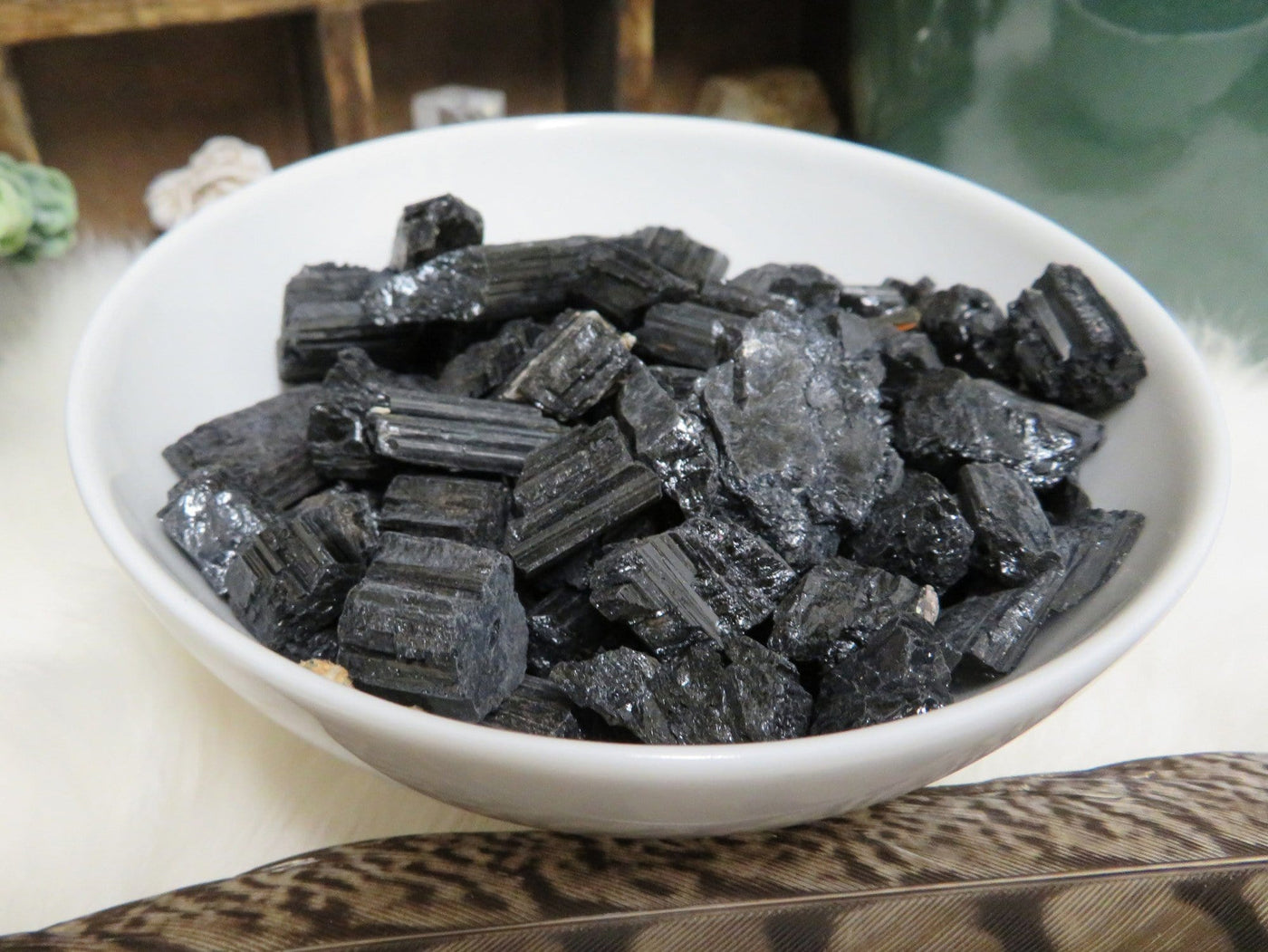 tourmaline chips in white bowl to show you can use them in a bowl for decor