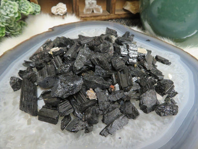 1 Pound of Black Tourmaline Assortment displayed to show various sizes like Pendant Size to Small Crumbles