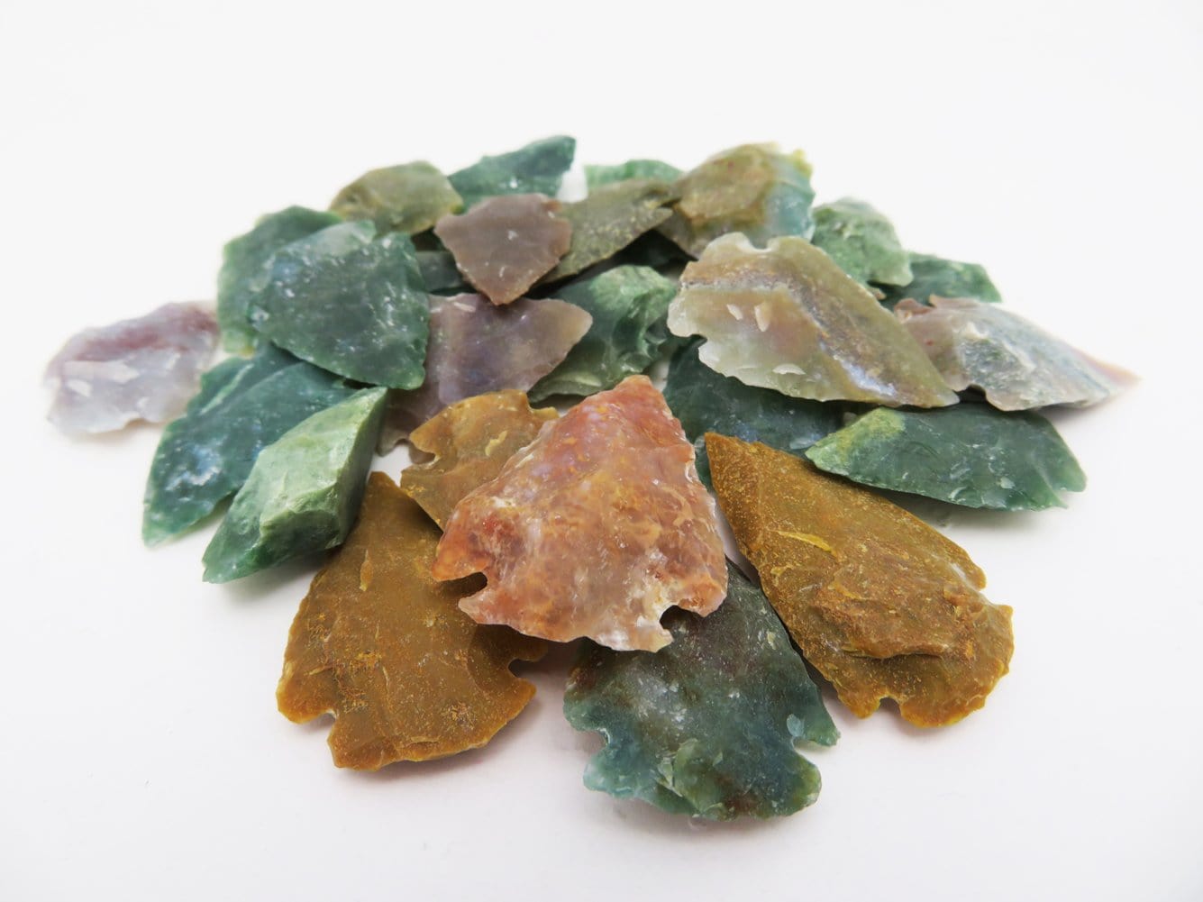Lots of Jasper Arrow Heads 1" size in a pile showing different colors available