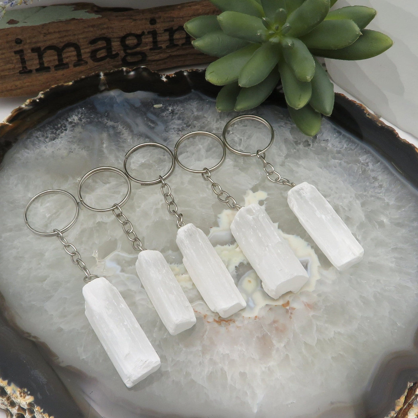 selenite silver toned key chains on display