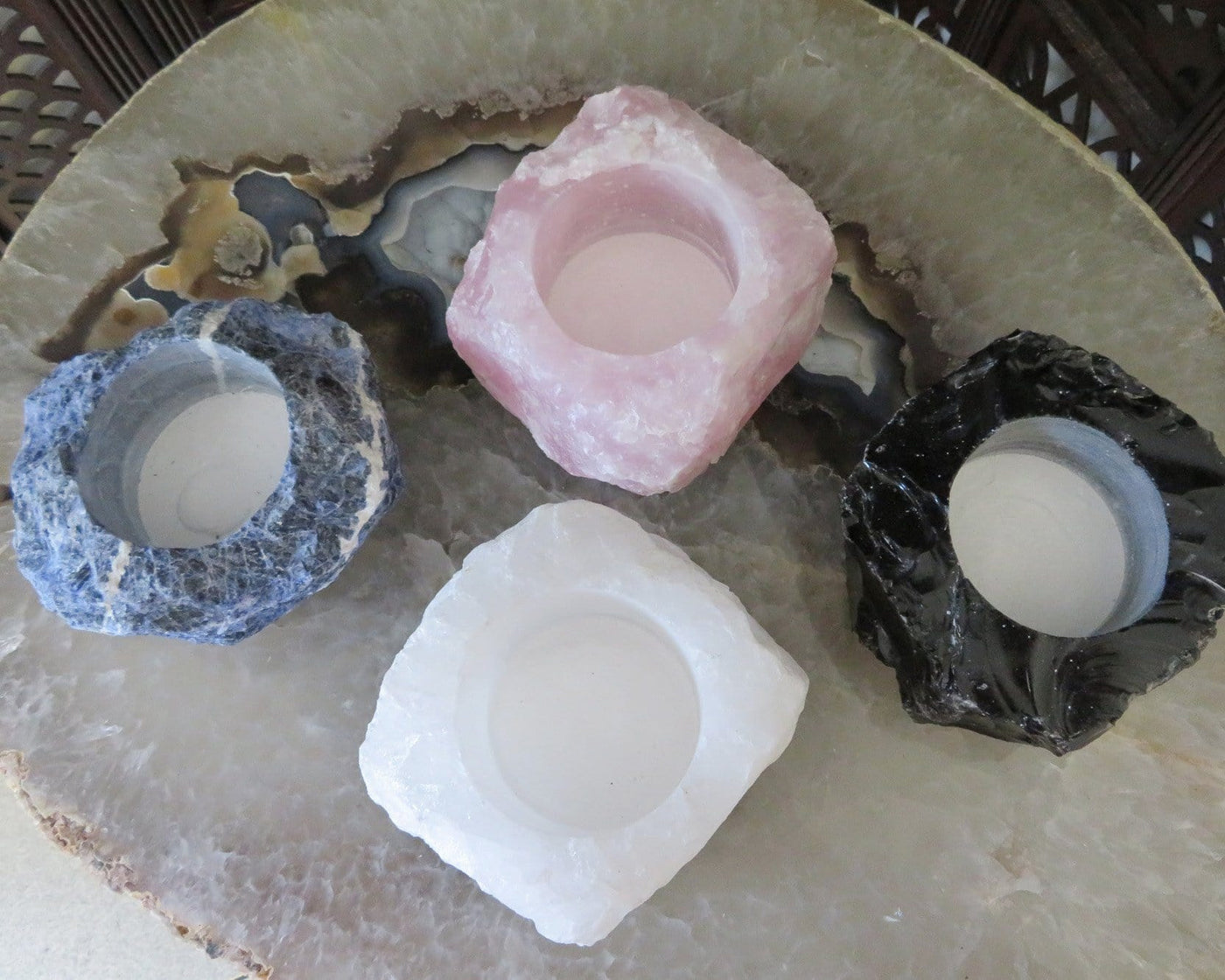 Top view of 4 Rough Stone Planters on top of crystal table top
