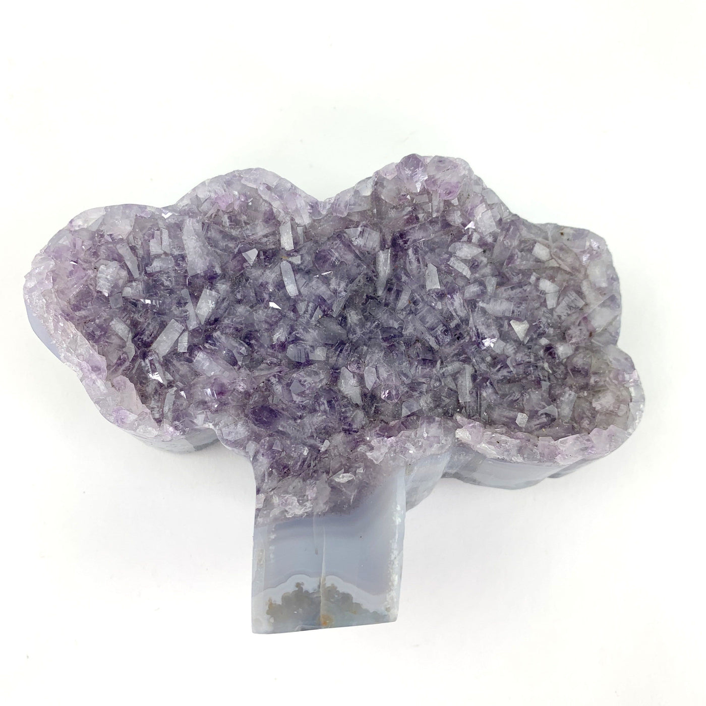 overhead view of semi-polished amethyst tree shape on display for details