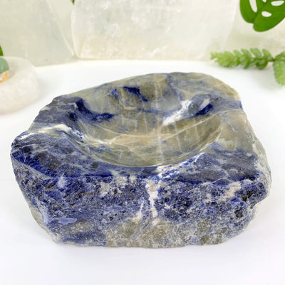 close up of semi-polished sodalite bowl on display for details