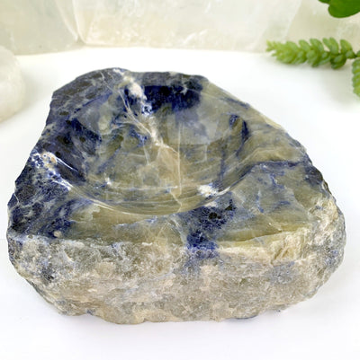 another close up angle of semi-polished sodalite bowl on display for details