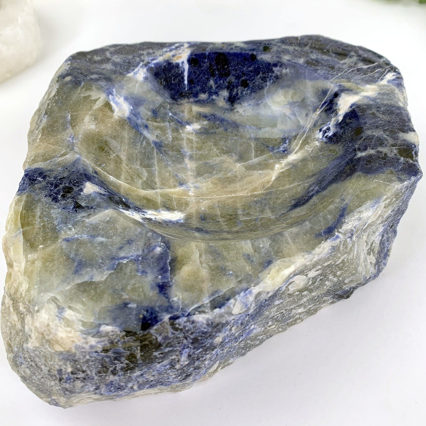 another close up angle of semi-polished sodalite bowl on display for details