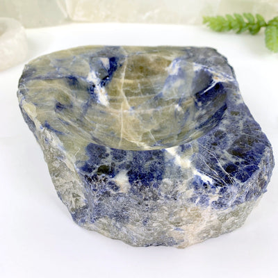 another close up angle of semi-polished sodalite bowl on display for details