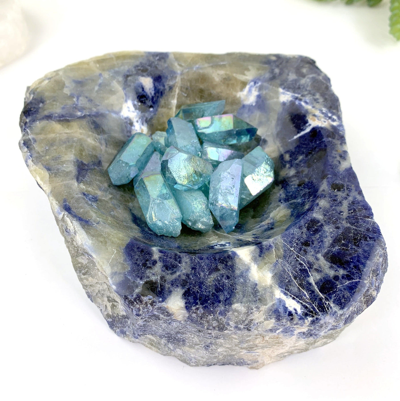 semi-polished sodalite bowl with stones inside (not included with purchase)
