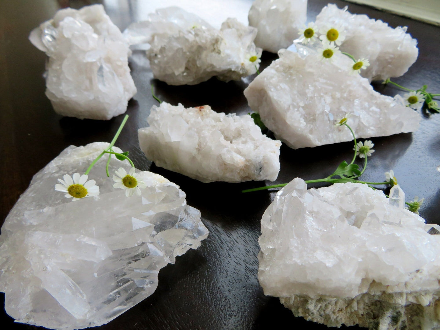 crystal quartz clusters with decorations in the background
