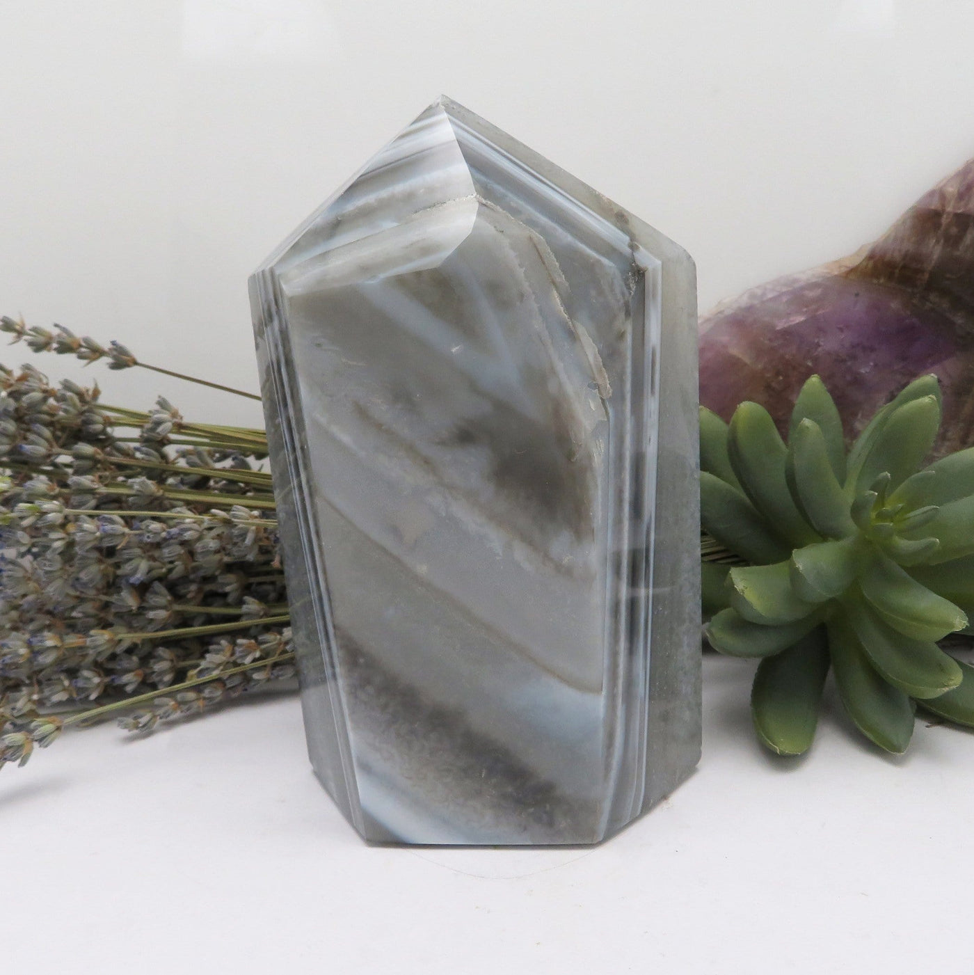 The back side view of Agate Druzy Polished Point (DOOAK-S36-32) in an alter.