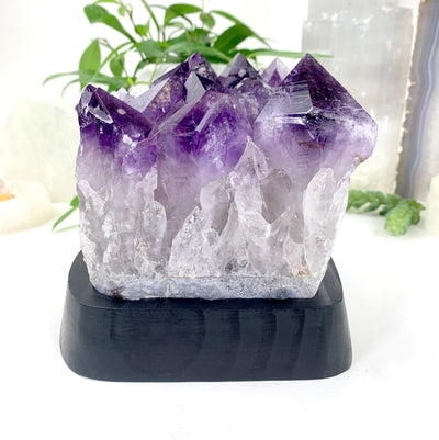 side view of Amethyst Cluster with Calcite Formations on Wood Base 
