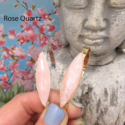 rose quartz bracelets in a hand