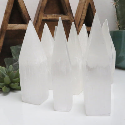many selenite tower obelisk points on display for possible variations