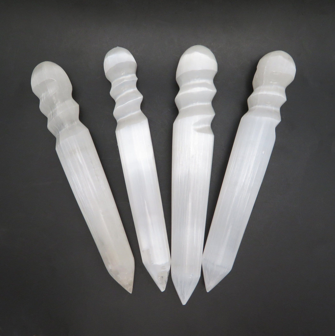 many selenite spiral twist massage wands on display for possible variations