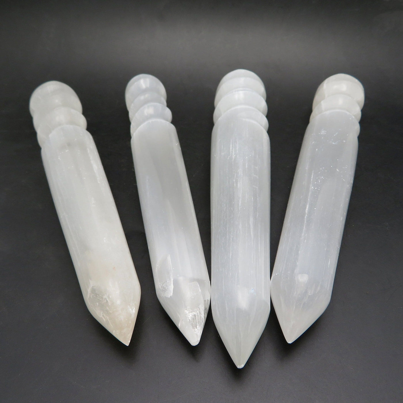 angled view of selenite spiral twist massage wands for details