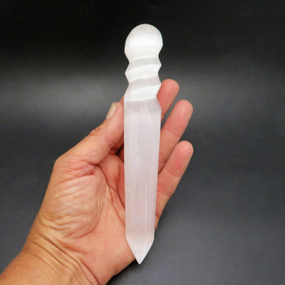 selenite spiral twist massage wand in hand for size reference